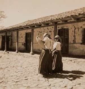 Untitled (Two women next to a house)