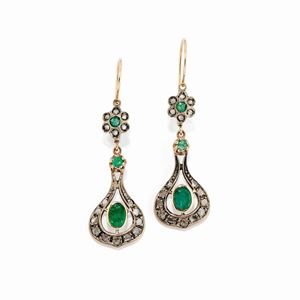 A 10k yellow gold, diamond and emerald earrings