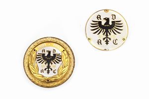 Two circular plates in gilded metal and enamels