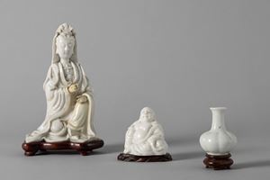 A blanc de chine porcelain Guanyin, one Budai, and a small vase. China, 19th/20th century