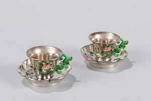 A pair of enameled silver cups. China, 20th century