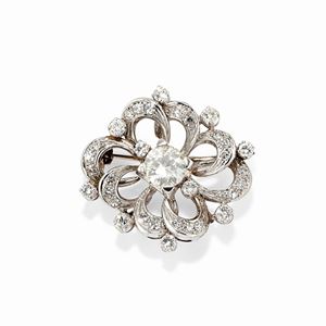  - A 18k white gold and diamond pendant-brooch