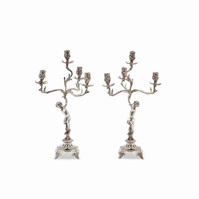 Candelabri in argento, Italia XX secolo, a quattro fiamme con putto