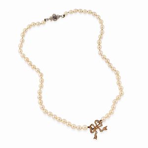 A 18k two-color gold, cultured pearl and sapphire necklace, defects