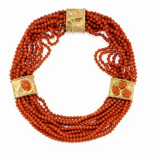 A 18k yellow gold, coral and diamond necklace