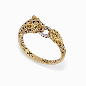 Bracciale in oro bicolore 18k, smeraldo, smalto nero e diamanti