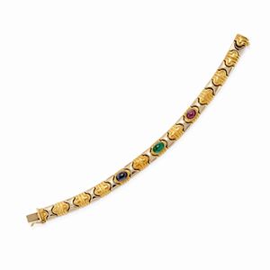  - Bracciale in oro bicolore 18k, zaffiro, rubino e smeraldo