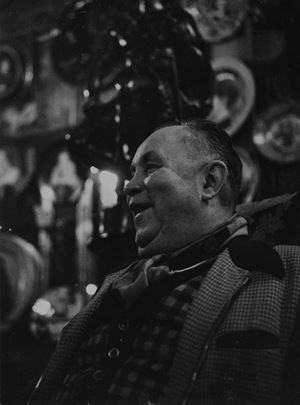 Laughing man in a bar in Paris