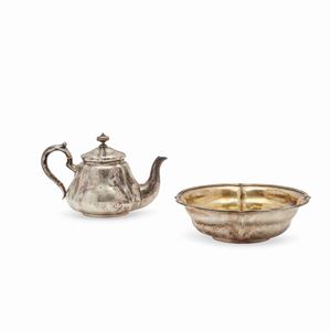  - A silver tea pot and centerpiece, 19th Century