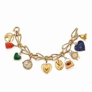  - A 18k yellow gold and charms bracelet