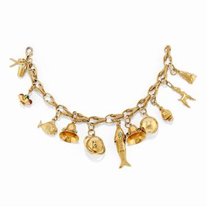  - A 18k yellow gold and charms bracelet, clasp not in gold