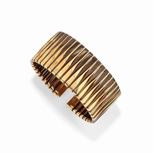 A 18k yellow gold and bronze bangle, Vhernier, with box and warranty