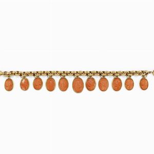 Bracciale charms in oro 18k e corallo