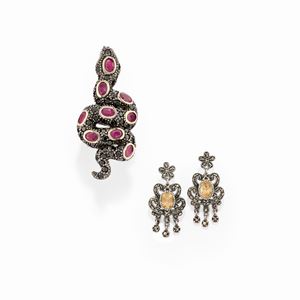 A silver, quartz, ruby and black gemstone ring and earrings