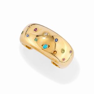 A 18k yellow gold, diamond, sapphire, ruby, emerald and colored gemstone bangle, with box
