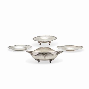 A silver centrepiece and three plates, Italy 20th Century