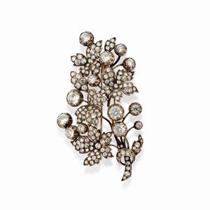 A silver, 18k yellow gold and uncolored gemstone brooch, defects