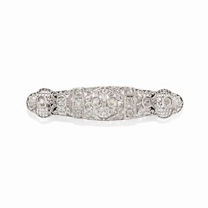  - A platinum, 18k white gold and diamond brooch, 1920-1930