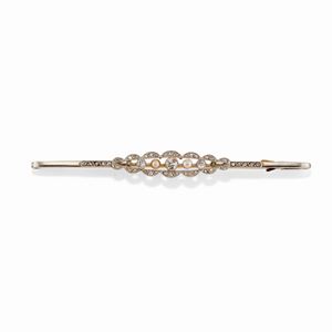  - A platinum, 18k yellow gold, diamond and pearl brooch, 1920-1930