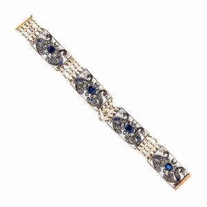  - Bracciale in oro giallo 18k, argento, diamanti, zaffiri, rubini e perle, XX secolo