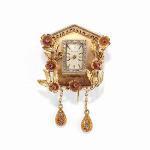 A 18k two-color gold, diamond and ruby brooch-watch