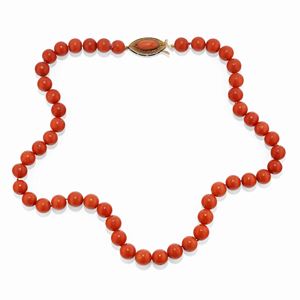  - A low carat gold and coral necklace
