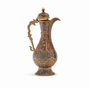 A brass and enamel pitcher