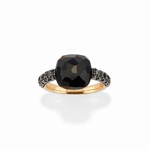 A 18k yellow gold, onyx and black diamond ring, Pomellato