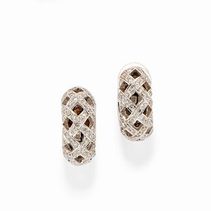 A 18k white gold and diamond earrings