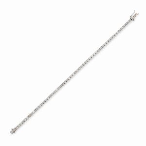 A 18k white gold and diamond tennis bracelet