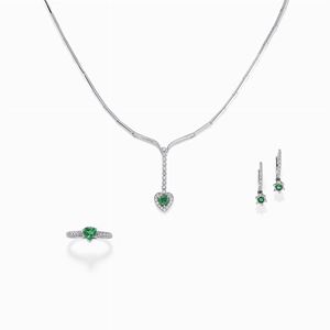 A 18K white gold diamond and emerald necklace, ring and earring