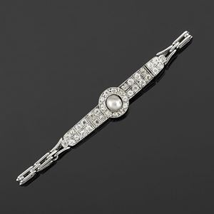 A 18K two color gold, diamond and pearl bracelet