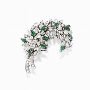A 18K white gold, diamond and emerald brooch