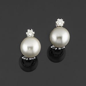 A 18K white gold, pearl and diamond earrings