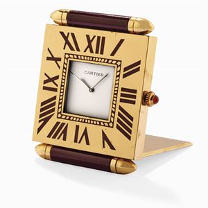 A metal gilded table watch, Cartier