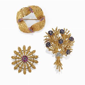 Three 18K yellow gold, diamond, ruby and sapphire brooches
