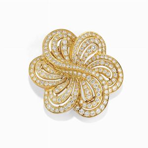 A 18K yellow gold and diamond brooch-pendant, Jacente
