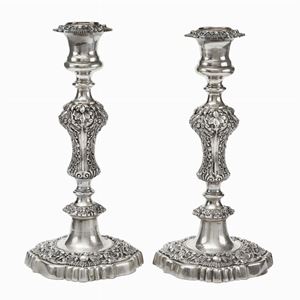  - A silver couple of candle sticks 