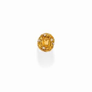 A 18k two-color gold, yellow quartz and diamond ring