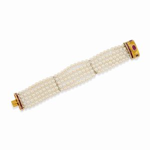 A 18k two-color gold, cultured pearl and ruby bracelet, defects