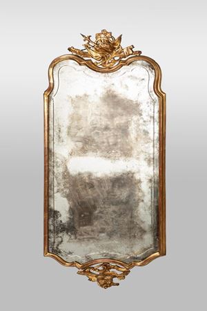 A carved and gil wood mirror, Venetian 18th c.