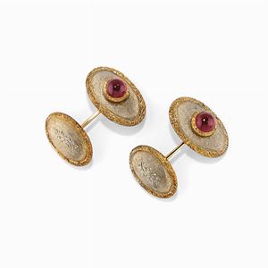 A 18K two-color gold and red gemstones cufflinks