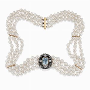 A silver, 18K gold, aquamarine, diamond and pearl necklace
