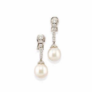 A 18k white gold, diamond and cultured pearl earrings