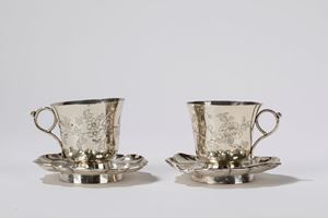A pair of silver cups and saucers. China, 19th/20th c.