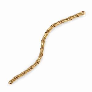 A 18k yellow gold bracelet, signed Cartier, with box
