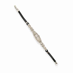 A 18k white gold, platinum, enamel and diamond wristwatch, circa 1920, defects