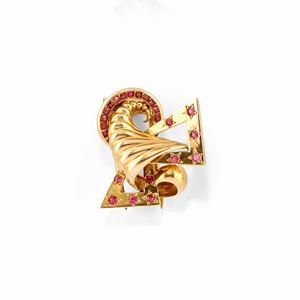 A 18k yellow gold and ruby brooch