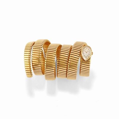 Bracciale orologio serpentiforme, oro giallo 18k, circa 1960