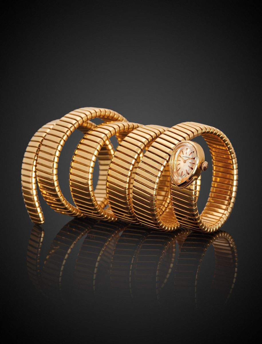 Bulgari - Bracciale orologio serpentiforme, oro giallo 18k, circa 1960